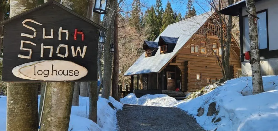 exterior photo of sunnsnow log house preferred partner